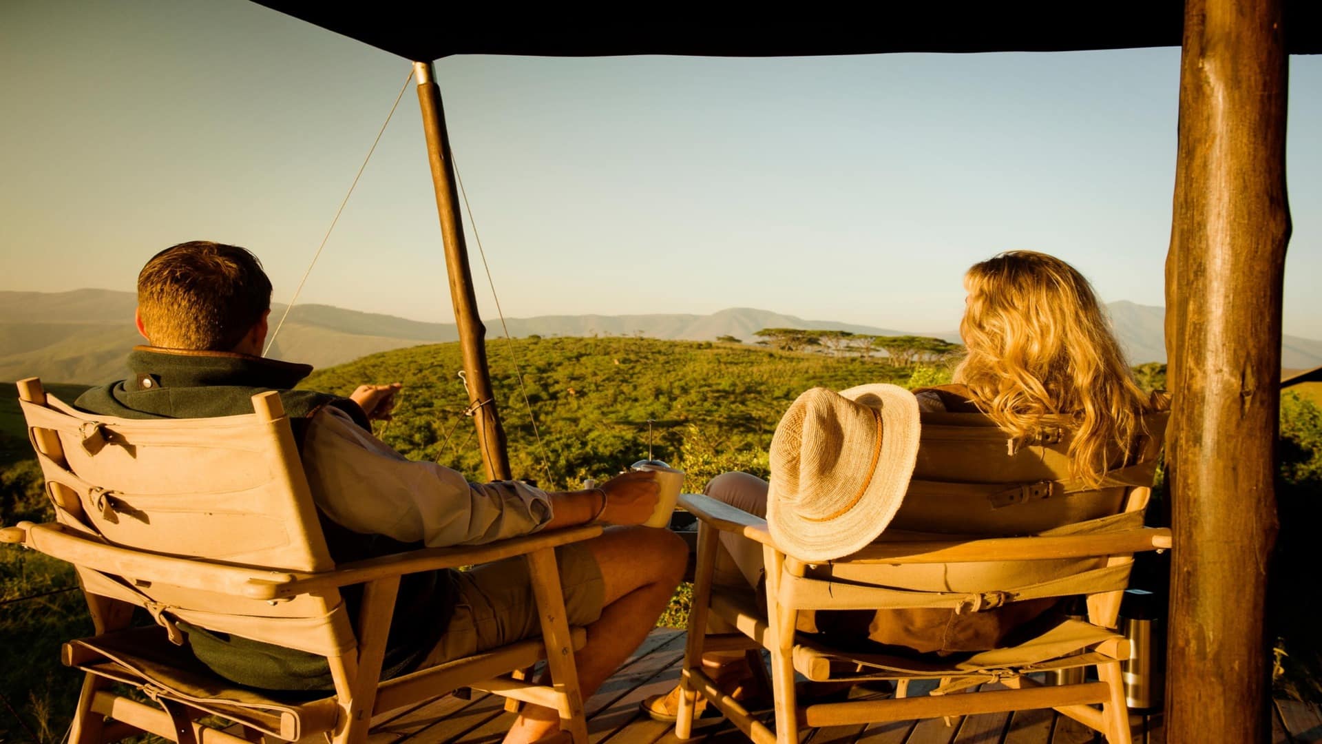 Aisanguyan Entamanu Ngorongoro Guests infront of tent looking into the savannah